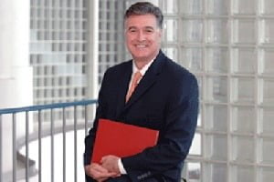 Dr. Tricoli photo with red book 1
